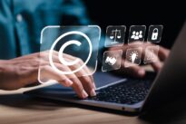 Laptop with virtual copyright symbol for author rights and patented intellectual property.